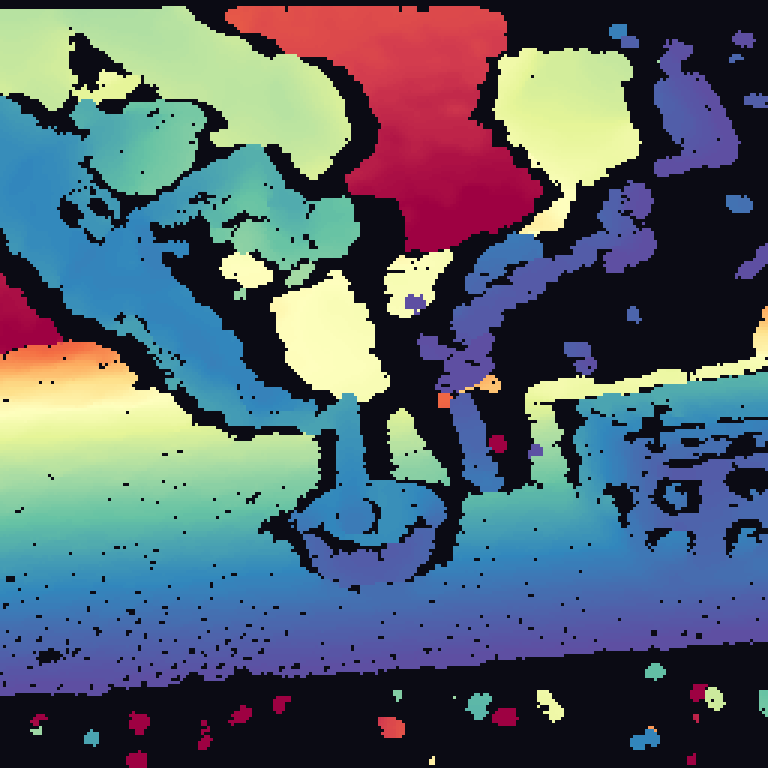 Colorized raw depth of a transparent test-tube scene from a side time-of-flight camera: large dark regions are missing measurements, and surfaces are distorted around the glass.